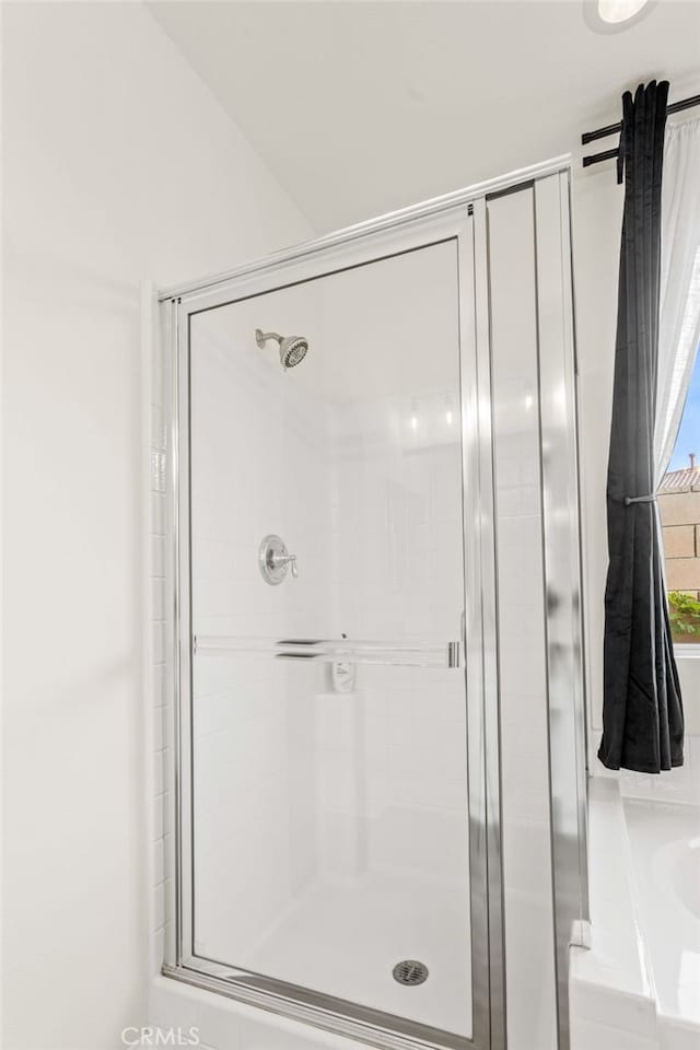 bathroom with separate shower and tub