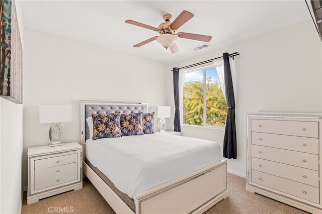 bedroom with light carpet and ceiling fan