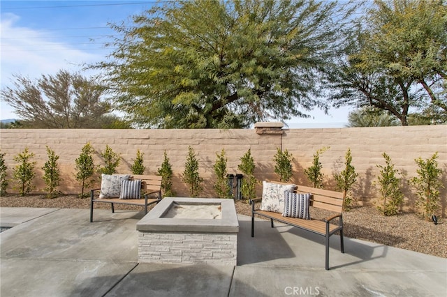 view of patio / terrace featuring an outdoor living space with a fire pit