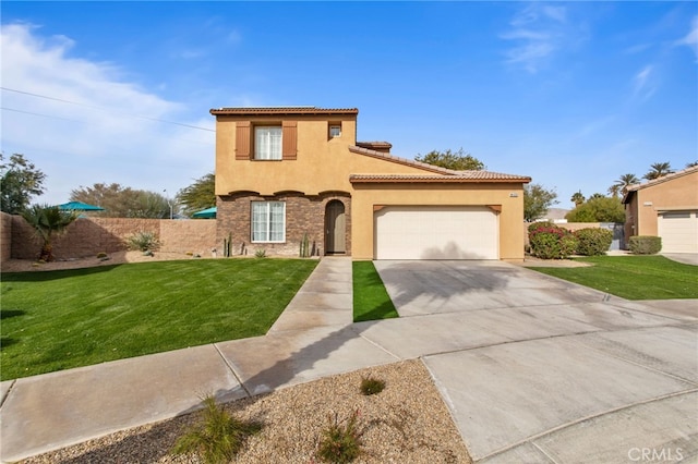 mediterranean / spanish house featuring a garage and a front lawn