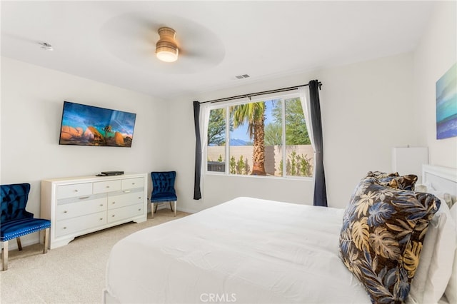 bedroom featuring ceiling fan and light colored carpet