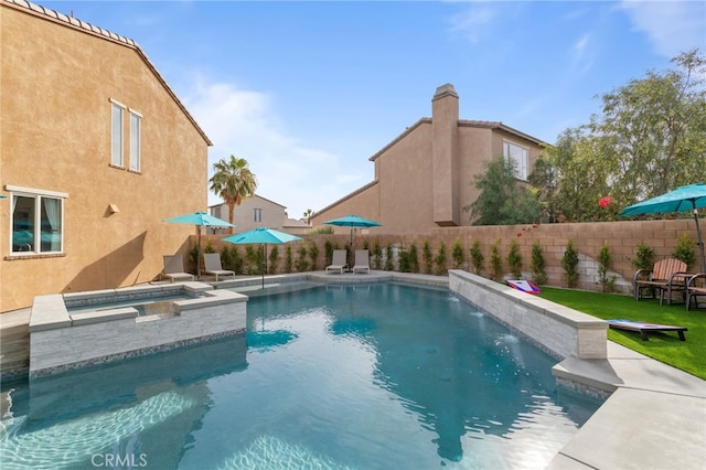 view of pool featuring an in ground hot tub and pool water feature