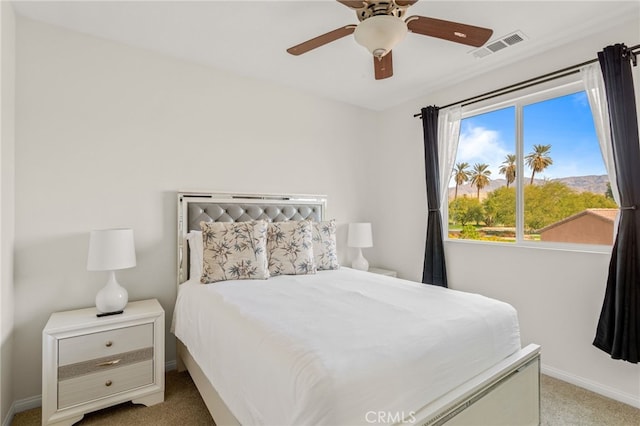 bedroom with light colored carpet and ceiling fan