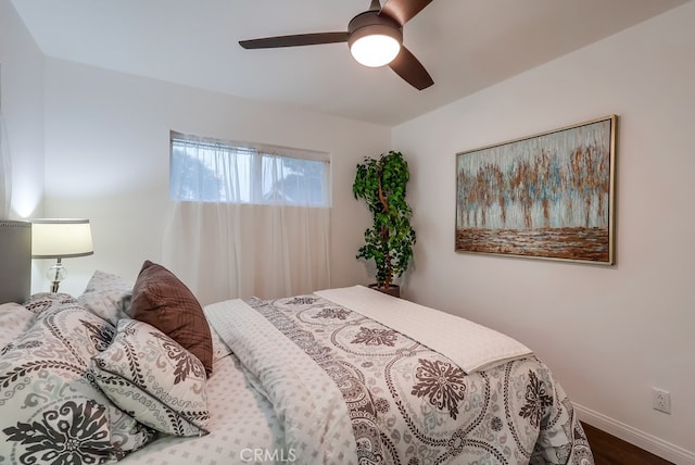 bedroom featuring hardwood / wood-style floors and ceiling fan