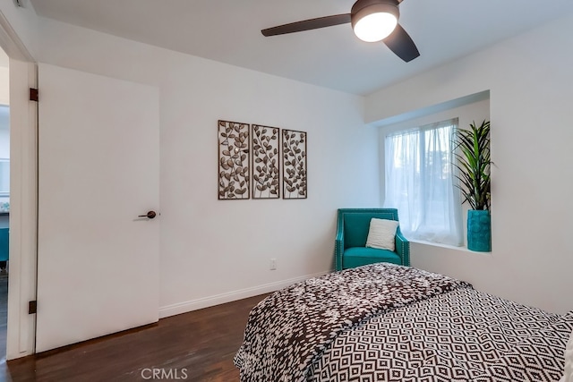 bedroom featuring dark hardwood / wood-style flooring and ceiling fan