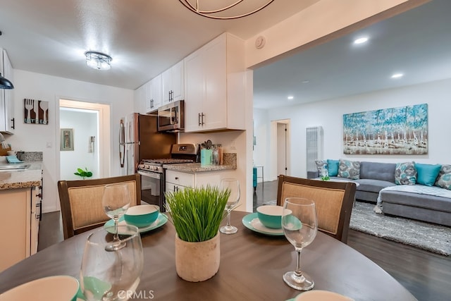 dining space featuring sink and dark hardwood / wood-style floors