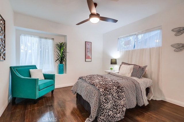 bedroom featuring ceiling fan and dark hardwood / wood-style flooring