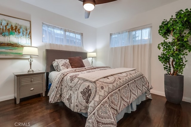 bedroom with dark wood-type flooring and ceiling fan