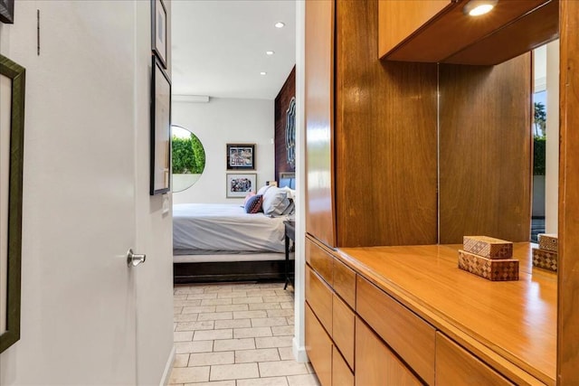 tiled bedroom with multiple windows