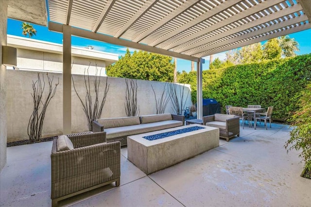 view of patio / terrace with area for grilling, a pergola, and an outdoor living space with a fire pit