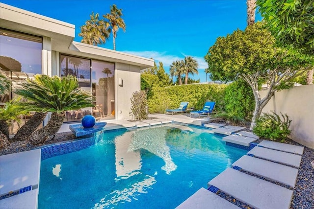 view of swimming pool featuring a patio area