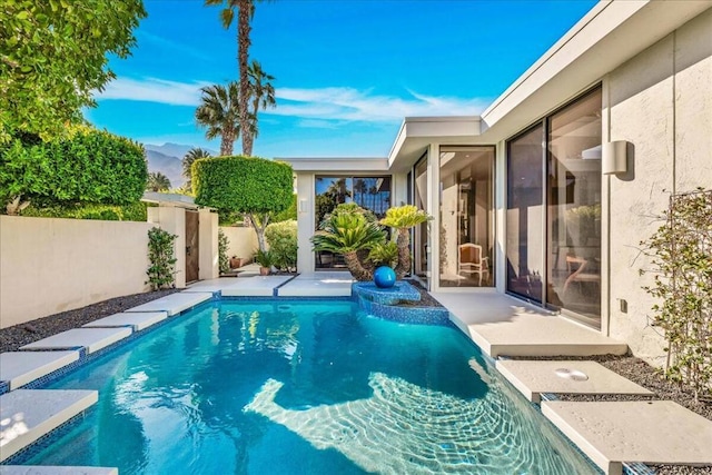 view of swimming pool featuring a patio area