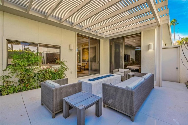 view of patio with a pergola and an outdoor living space with a fire pit