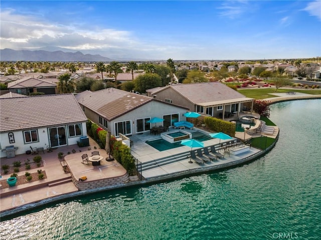 bird's eye view featuring a water and mountain view