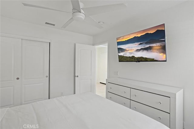 bedroom featuring ceiling fan and a closet