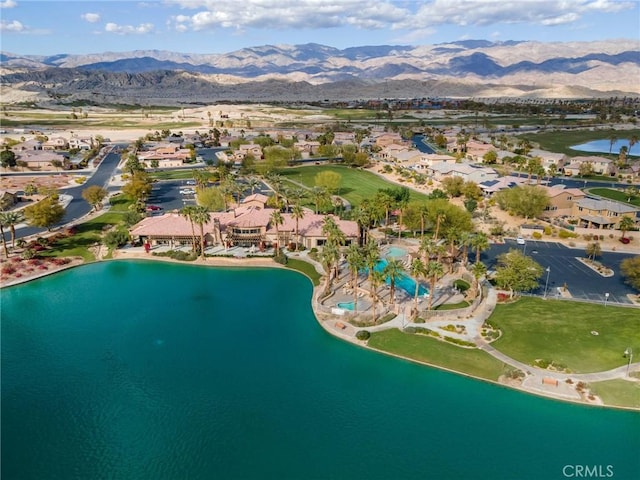 aerial view featuring a water and mountain view