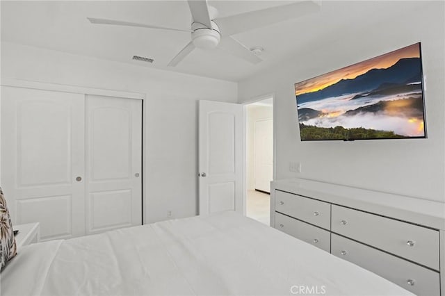 bedroom featuring ceiling fan and a closet