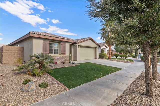 view of front of property featuring a garage and a front yard