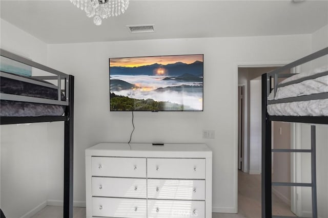 unfurnished bedroom featuring a notable chandelier