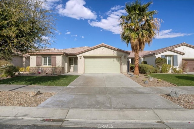 view of front of home with a garage and a front yard