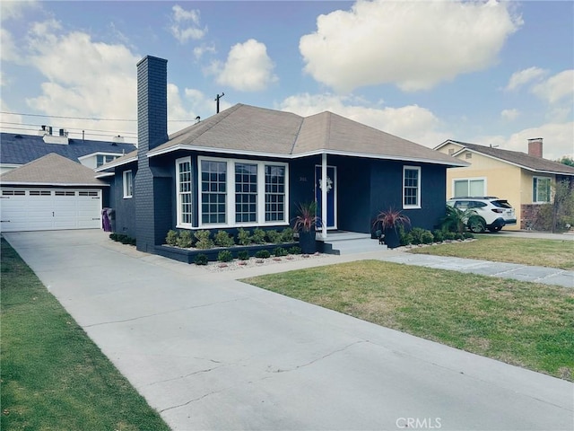 ranch-style home featuring a garage and a front lawn