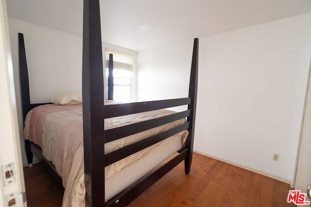 bedroom featuring hardwood / wood-style flooring