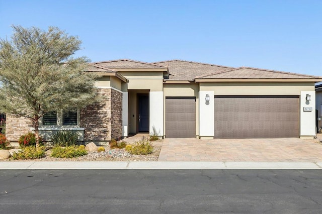 prairie-style house featuring a garage