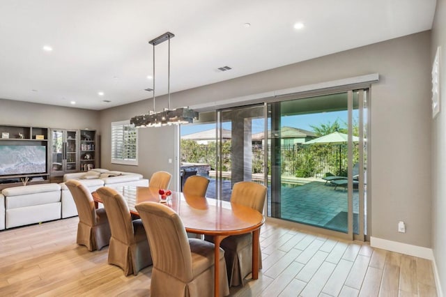 dining area with light hardwood / wood-style floors