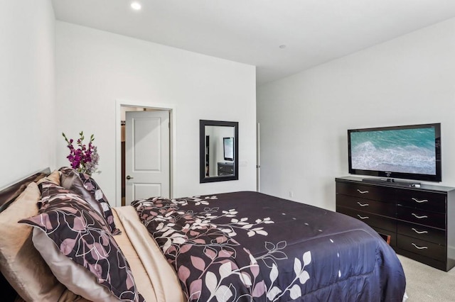 bedroom featuring light colored carpet