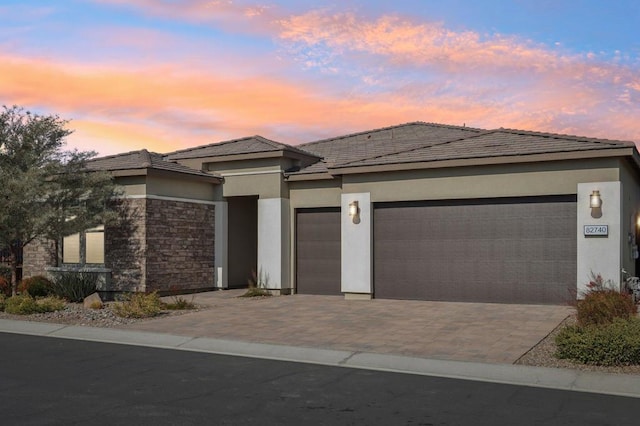 prairie-style home featuring a garage