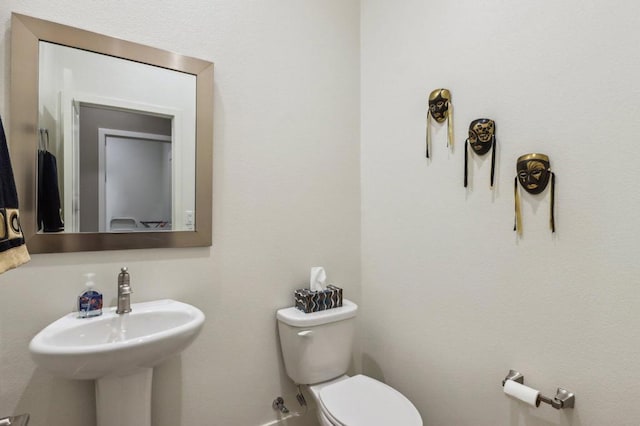 bathroom with sink and toilet