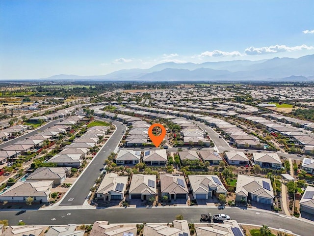 birds eye view of property featuring a mountain view