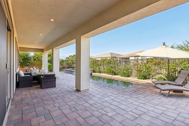 view of patio with a fenced in pool and an outdoor hangout area