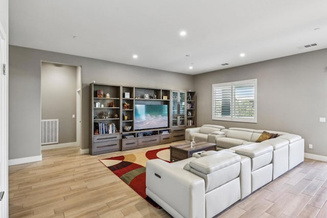 living room with light hardwood / wood-style flooring