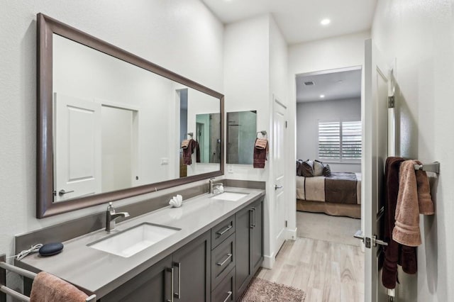 bathroom with vanity and wood-type flooring