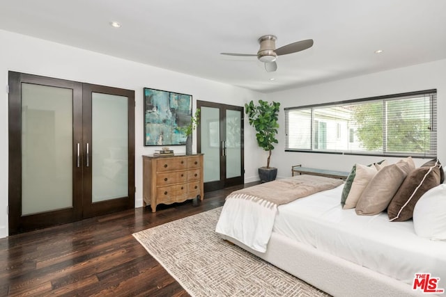 bedroom with french doors, ceiling fan, and dark hardwood / wood-style floors