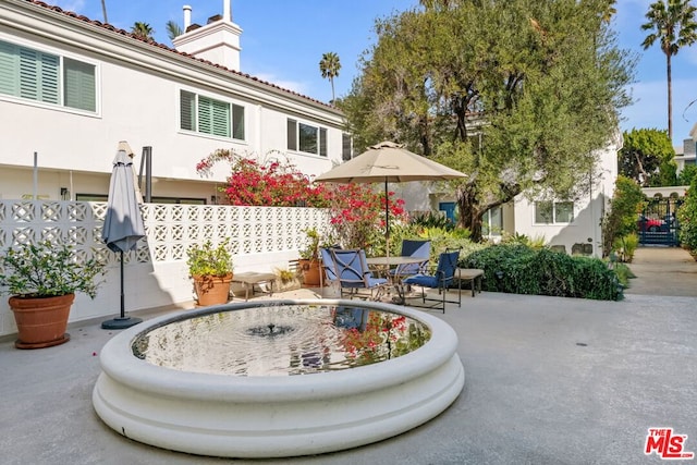 view of home's community with a patio