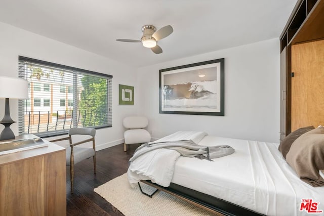 bedroom with dark wood-type flooring and ceiling fan