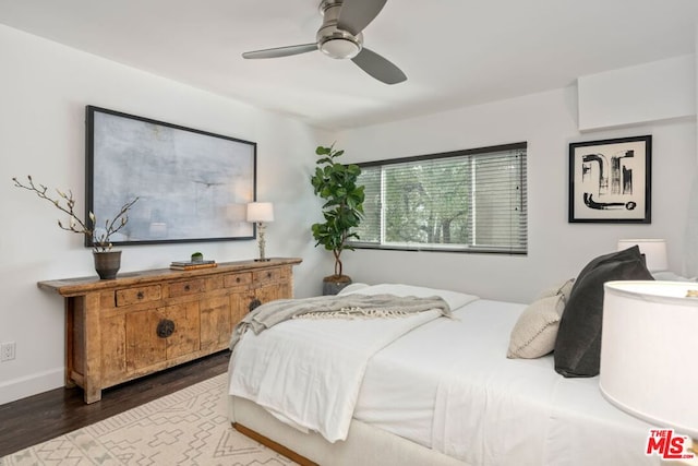 bedroom featuring wood-type flooring and ceiling fan