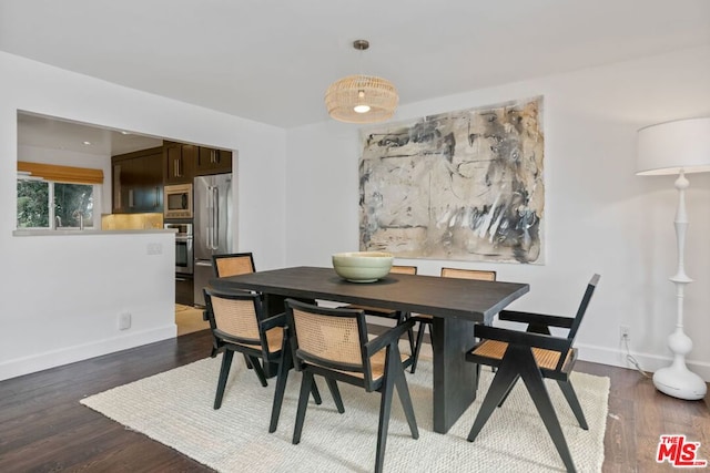 dining room with dark wood-type flooring