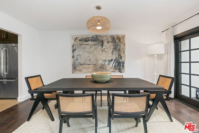 dining space featuring hardwood / wood-style floors