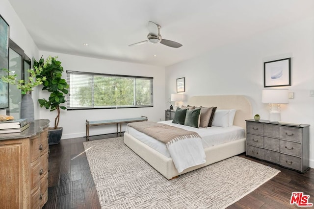 bedroom featuring hardwood / wood-style floors and ceiling fan