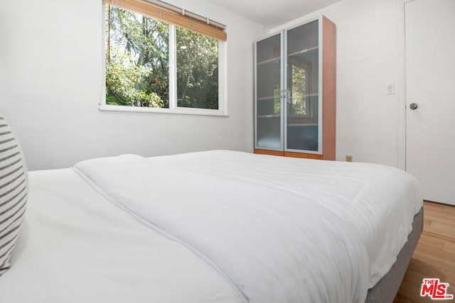 bedroom featuring hardwood / wood-style floors