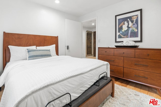 bedroom with light hardwood / wood-style flooring