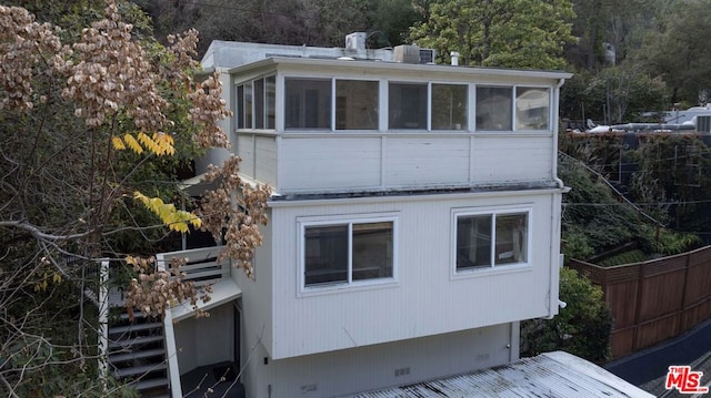 back of property featuring a sunroom