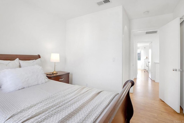 bedroom with light wood-type flooring