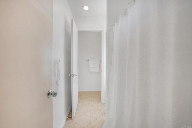 bathroom with tile patterned floors