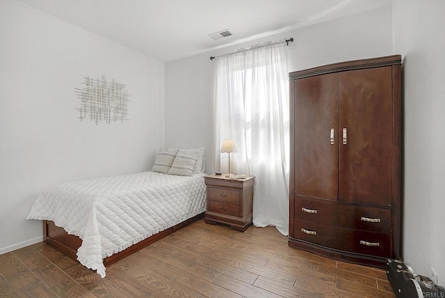 bedroom featuring dark hardwood / wood-style floors