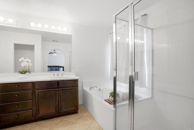 bathroom featuring ceiling fan, tile patterned floors, separate shower and tub, and vanity