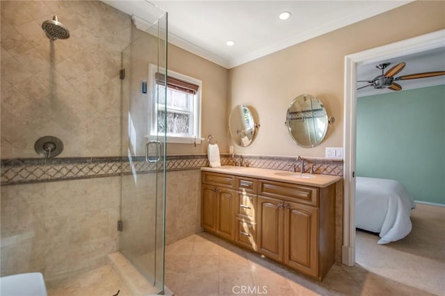 ensuite bathroom featuring ornamental molding, ensuite bath, vanity, and a shower stall